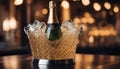 Sparkling wine bottle in ice bucket on blurred restaurant background Royalty Free Stock Photo