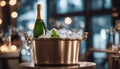 Sparkling wine bottle in ice bucket on blurred restaurant background Royalty Free Stock Photo