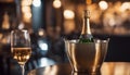 Sparkling wine bottle in ice bucket on blurred restaurant background Royalty Free Stock Photo