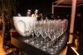 Sparkling wine bottle in the ice bucket and wine glasses in a restaurant setting Royalty Free Stock Photo