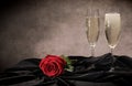 Sparkling wine and red roses in close-up Royalty Free Stock Photo