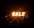 Sparkly blocky Sale word on dark background.