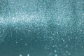 Sparkly glitter, blue background bokeh effect Royalty Free Stock Photo