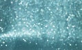 Sparkly glitter, turquoise background bokeh effect Royalty Free Stock Photo