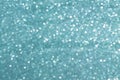 Sparkly glitter, turquoise background bokeh effect Royalty Free Stock Photo