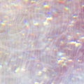 Sparkly pink holographic textured background