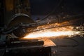 Sparks from circular saw at steel factory. Metal sawing close up. Royalty Free Stock Photo