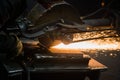 Sparks from circular saw at steel factory. Metal sawing close up. Royalty Free Stock Photo