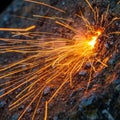 The sparks disperse outward in various directions creating a dynamic effect Royalty Free Stock Photo