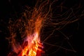 Sparks from a fire against dark night. Bonfire Royalty Free Stock Photo