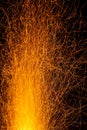 Sparks from a fire against dark night. Bonfire Royalty Free Stock Photo