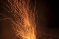 Sparks from a fire against a dark night. Bonfire Royalty Free Stock Photo