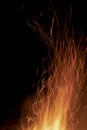 Sparks from a fire against a dark night. Bonfire Royalty Free Stock Photo