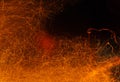 Sparks of fire on a black. Abstract background with fire sparks Royalty Free Stock Photo