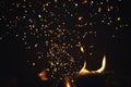 Sparks from fire in fireplace with bokeh balls