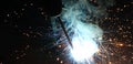 Sparks and jets of smoke when welding Royalty Free Stock Photo