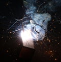 Sparks and jets of smoke when welding Royalty Free Stock Photo