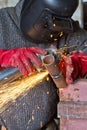 Sparks when machining a weld bead on the pipe Royalty Free Stock Photo