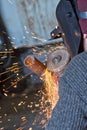 Sparks when machining a weld bead on the pipe Royalty Free Stock Photo