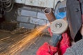Sparks when machining a weld bead on the pipe Royalty Free Stock Photo