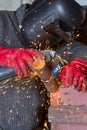 Sparks when machining a weld bead on the pipe Royalty Free Stock Photo