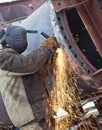 Sparks when machining a weld bead on the pipe Royalty Free Stock Photo