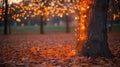 Sparse autumn tree with glowing string lights wrapped around its branches Royalty Free Stock Photo