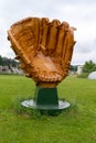 Large baseball glove mitt fiberglass roadside attraction statue against the overcast sky Royalty Free Stock Photo