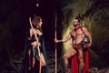 Spartan warrior and his woman in the woods Royalty Free Stock Photo