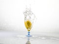 Spashing water on glass with lemon