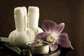 SpaSpa herbal compressing ball with candles and orchid Royalty Free Stock Photo