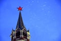 Spasskaya clock tower of Moscow Kremlin at snowfall. Popular landmark.