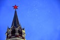 Spasskaya clock tower of Moscow Kremlin at snowfall. Popular landmark.