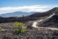 Spatter Cones trail, a paved walkway leading to a cinder cone wi in Craters of the Moon National Monument in Idaho Royalty Free Stock Photo