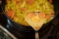 A spatula for cooking with an image in the form of a smiley face made of carrots Royalty Free Stock Photo