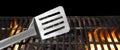 Spatula On The Hot Flaming BBQ Grill Close-up Royalty Free Stock Photo