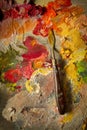 Spatula on a palette with oil paints