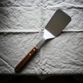 Spatula s blade is flat and rectangular suitable for flipping or serving Royalty Free Stock Photo