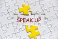 Speak Up text on missing jigsaw puzzle representing business culture in exercising rights to speak up Royalty Free Stock Photo