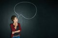 Speak your mind. Studio shot of a young woman posing with a chalk illustration of a speech bubble against a dark