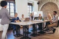 Speaker at business workshop entrepreneur giving a presentation about positive business growth to  colleagues in the office Royalty Free Stock Photo