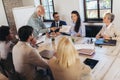 Speaker at business workshop entrepreneur giving a presentation about positive business growth to  colleagues in the office Royalty Free Stock Photo