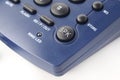 Speaker Button on a modern land line phone in blue color