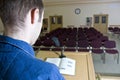 Speaker in empty auditorium