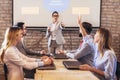 Speaker giving public presentation using projector in conference room