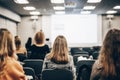 Speaker giving a talk in conference hall at business event. Rear view of unrecognizable people in audience at the Royalty Free Stock Photo