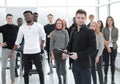 Speaker and a group of young listeners standing in a conference room. Royalty Free Stock Photo