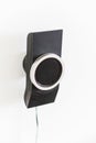 Speaker mounted on a white wall. Part of the home theater 5 to 1