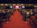 Speaker at podium speaks at luncheon honoring the First Ladies of the state in front of the state flag November 17, 2004 in the bu