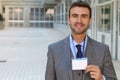 Speaker showing his id badge